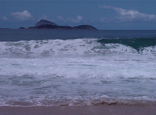 Indigo blue waves washing the sands