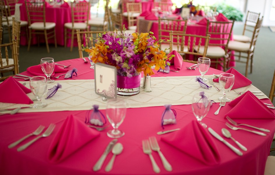 white and gold table runner on hot pink tablecloth for wedding
