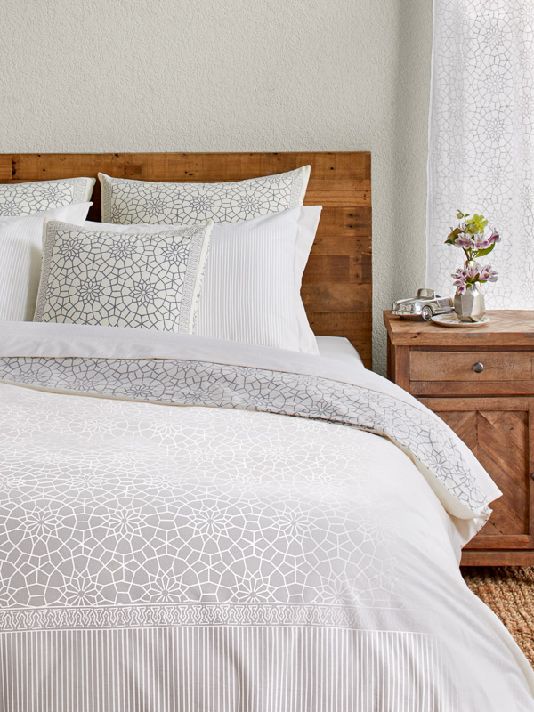 white duvet cover with moroccan pattern in winter wonderland theme bedroom