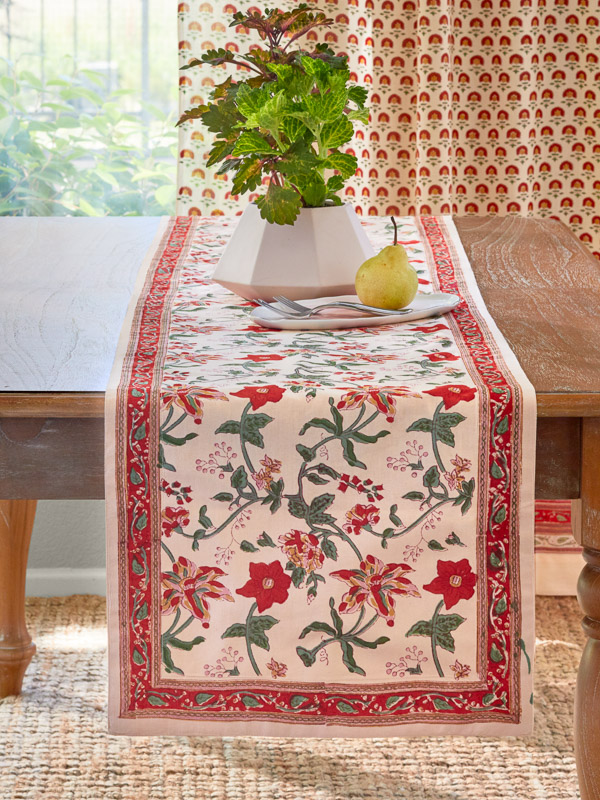 red floral table runner in a tropical house