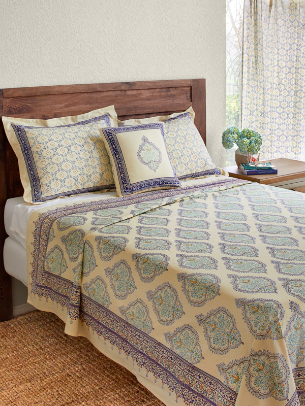 yellow and teal bedding with bohemian design