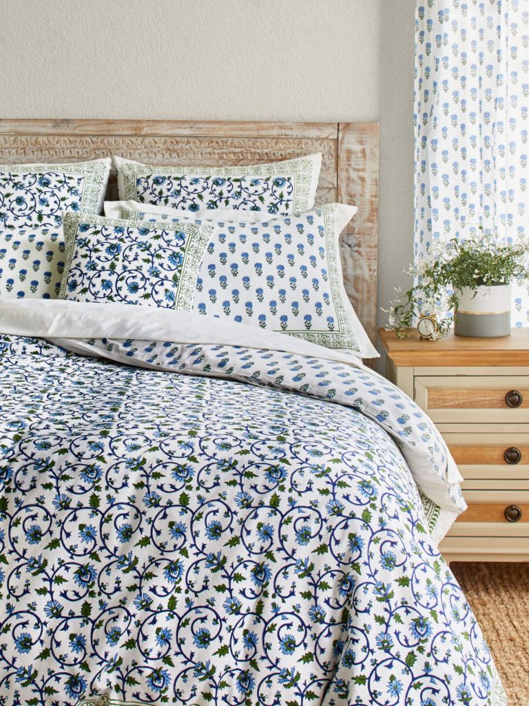 white blue and green floral duvet cover and pillows