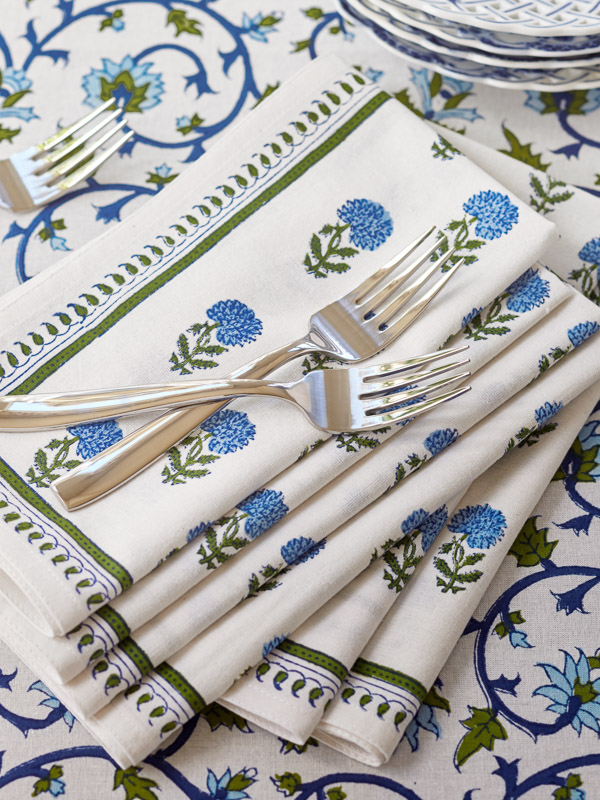 cloth napkins with blue flowers on a botanical tablecloth