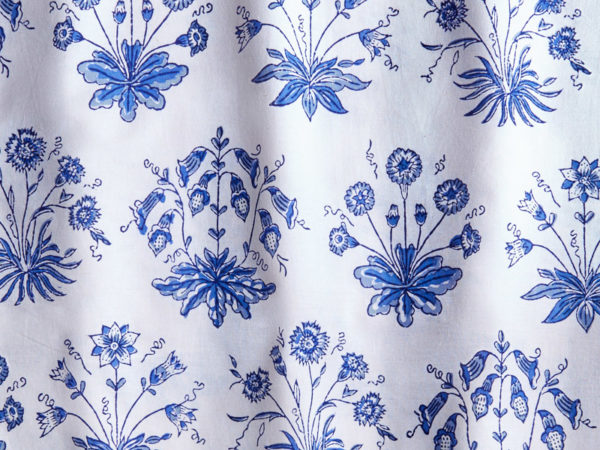 A white fabric swatch with English cottage blue floral print