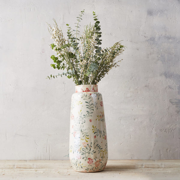 rose and vine vase holding eucalyptus leaves as a piece of spring decor