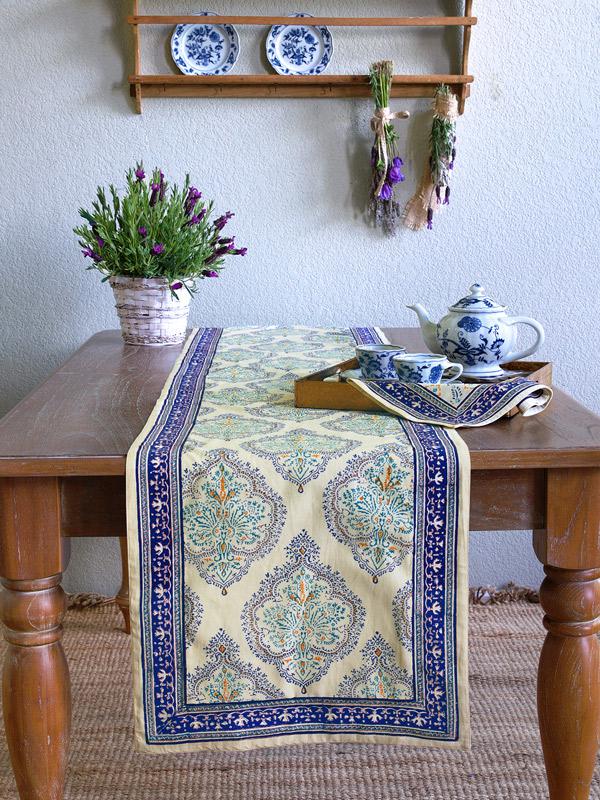 a spring table runner in spring colors like yellow and blue updates spring decor in the kitchen