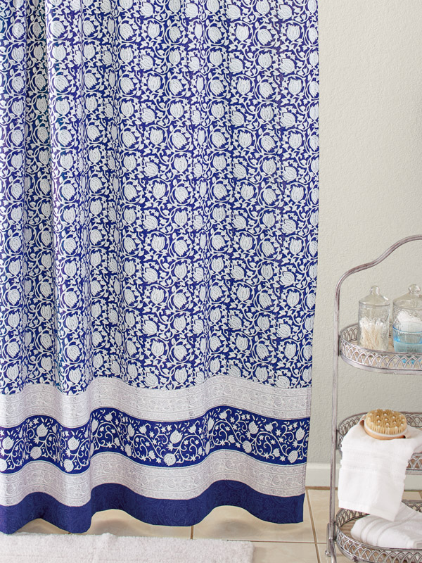 a blue floral shower curtain with a lotus pattern updates spring decor in the bath
