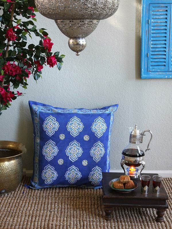 Blue and white Moroccan pillow sham with tea set