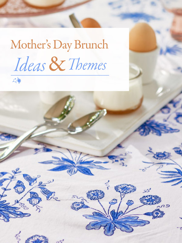 blue and white floral tablecloth, egg cups, spoons, and a sign that says Mother's Day Brunch Ideas & Themes