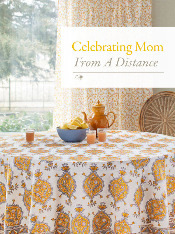 yellow tablecloth in a sunny room with a sign that says Celebrating Mom From A Distance