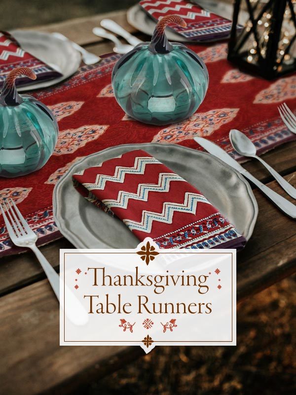 red table runner with blue pumpkins and sign reading Thanksgiving table runners