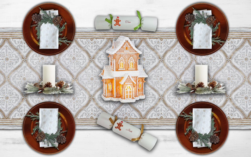 A white and gold Christmas table runner holds a Christmas tablescape with a gingerbread theme