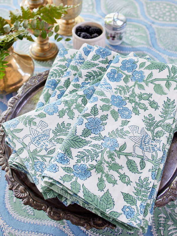 Nature-inspired napkins that go with a woodland-inspired elegant Christmas table runner