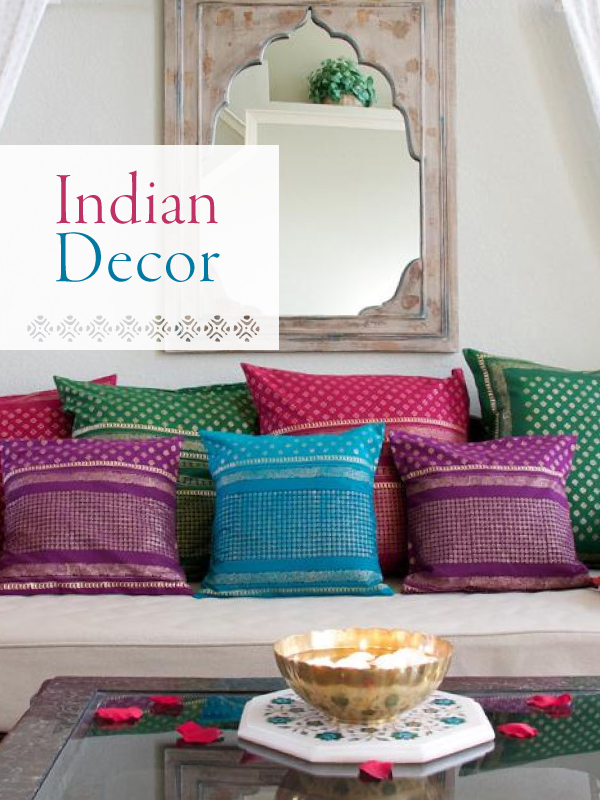 indian decor that consists of a collection of gilded sari block print pillows and limewashed indian mirror 