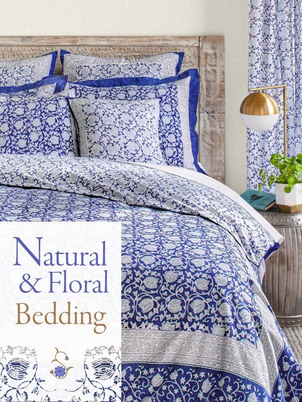 Blue floral bedding with a white and blue lotus flower pattern