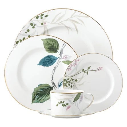 white dinnerware set with branches and leaves