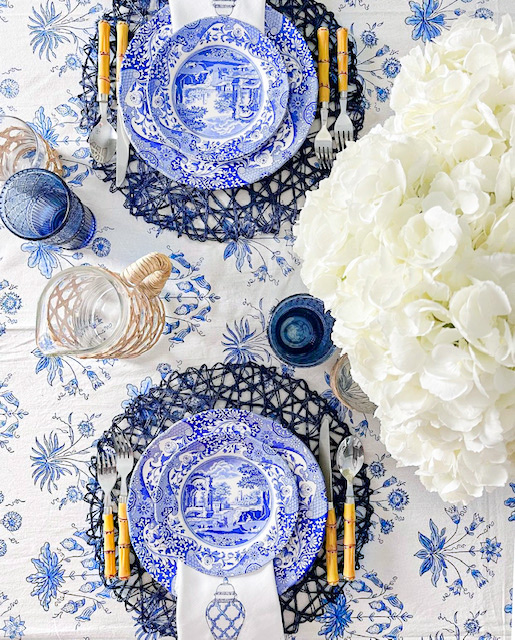 blue and white floral tablecloth with blue china and white flowers