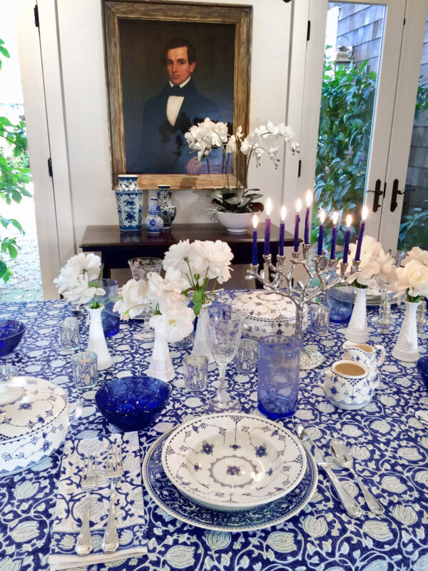 blue tablecloth with flower pattern for Hanukkah party, menorah, china
