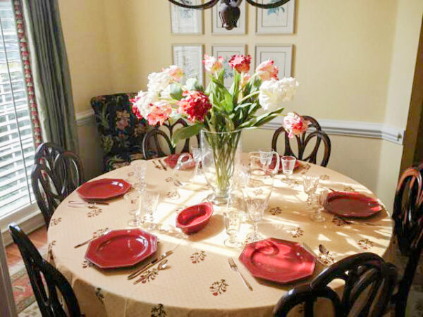 round Christmas tablecloth with red and green flowers