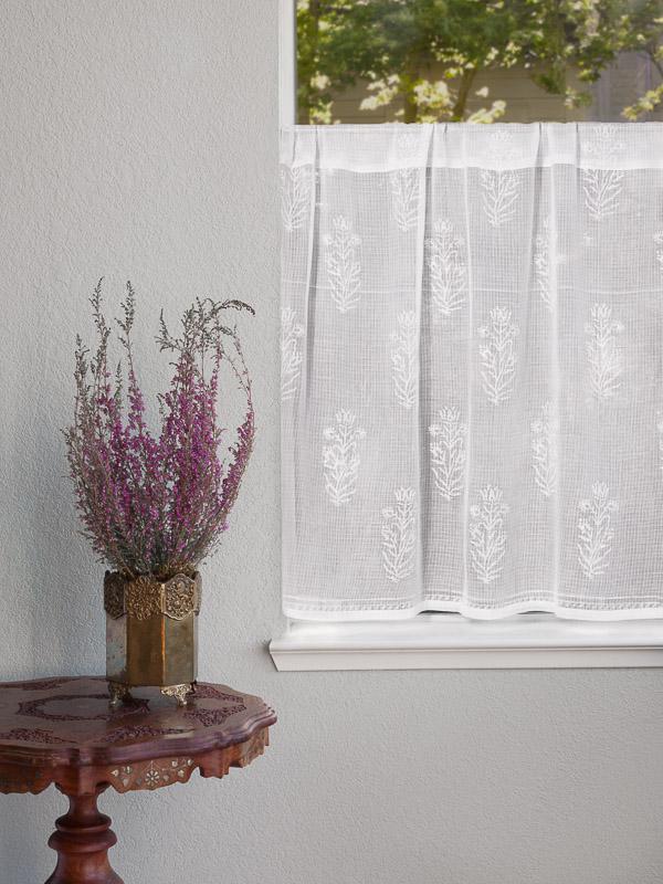 white sheer curtains with floral pattern