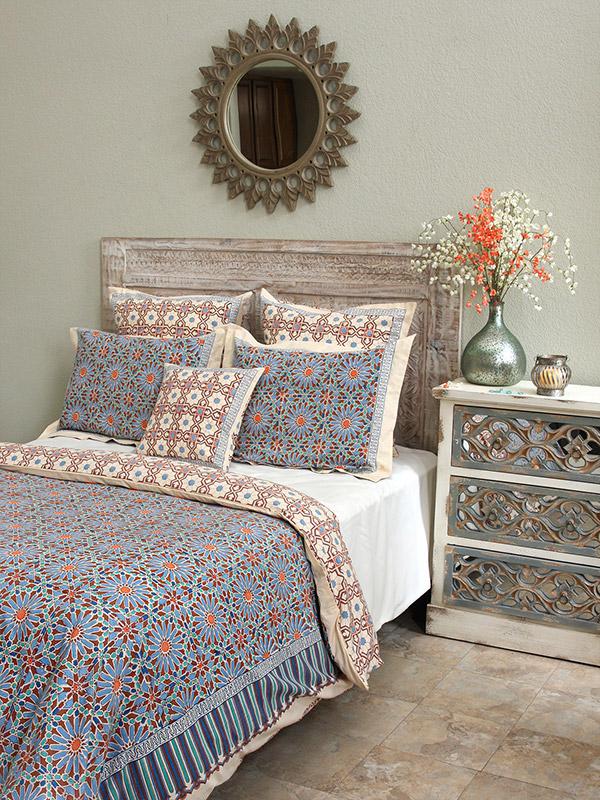 Boho-inspired, multicolor duvet cover, pillow covers, and shams featuring Moroccan zellige with complementary metal decor