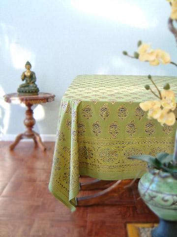 A picture of Memories of Shalimar rectangle table cloth in a warm green with chocolate, gold, and navy blue accents