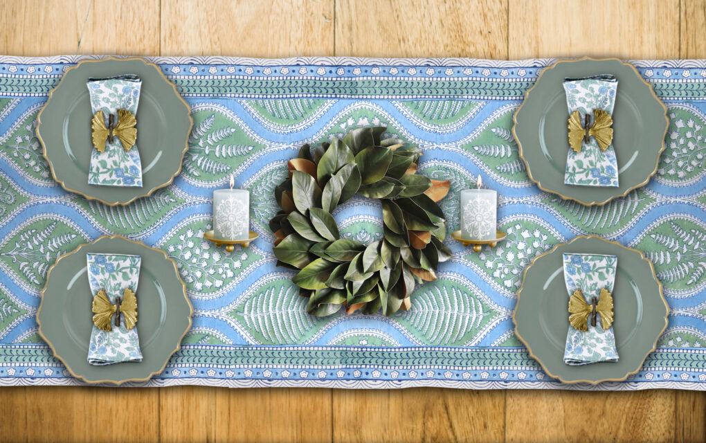 Elegant christmas table runner using sage green and nature-inspired table decor
