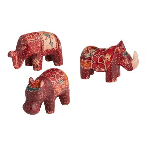 Three red carved animals with batik designs