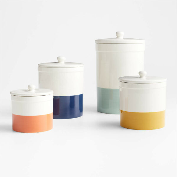 A set of canisters with the bottoms dipped in color