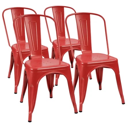 Four red metal chairs staggered in two rows of two