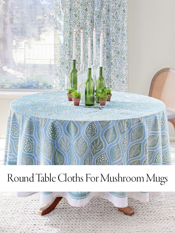 Blog hero image of blue and green botanical table cloth with overlaid text that reads round table cloths for mushroom mugs