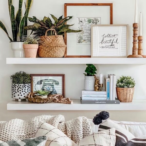 Homey, personalized shelf decor on two white floating shelves