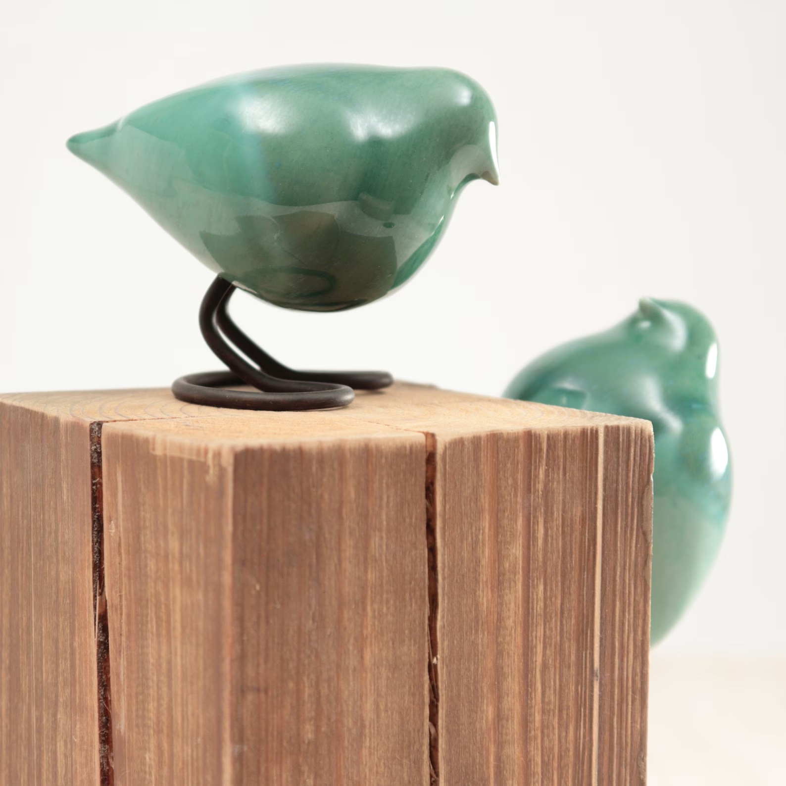 A green ceramic bird to show what can look good with white decor