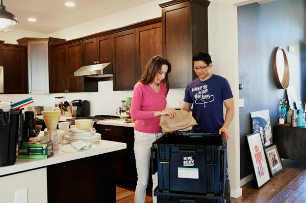 Example of a couple following ways on how to declutter the home by going through items together