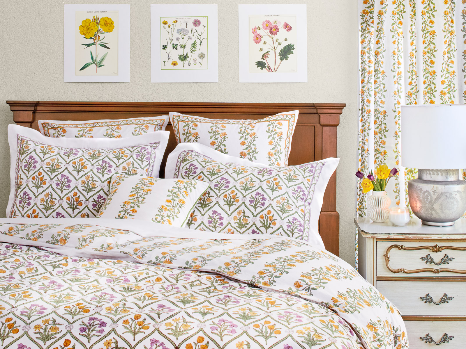 Bedroom with floral print on t he bedding and curtain