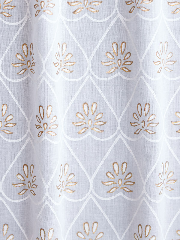 A white and gold fabric swatch that can be used with white decor