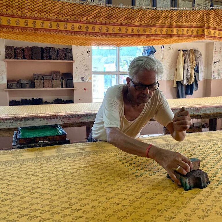Artisan patterning a paisley print fabric