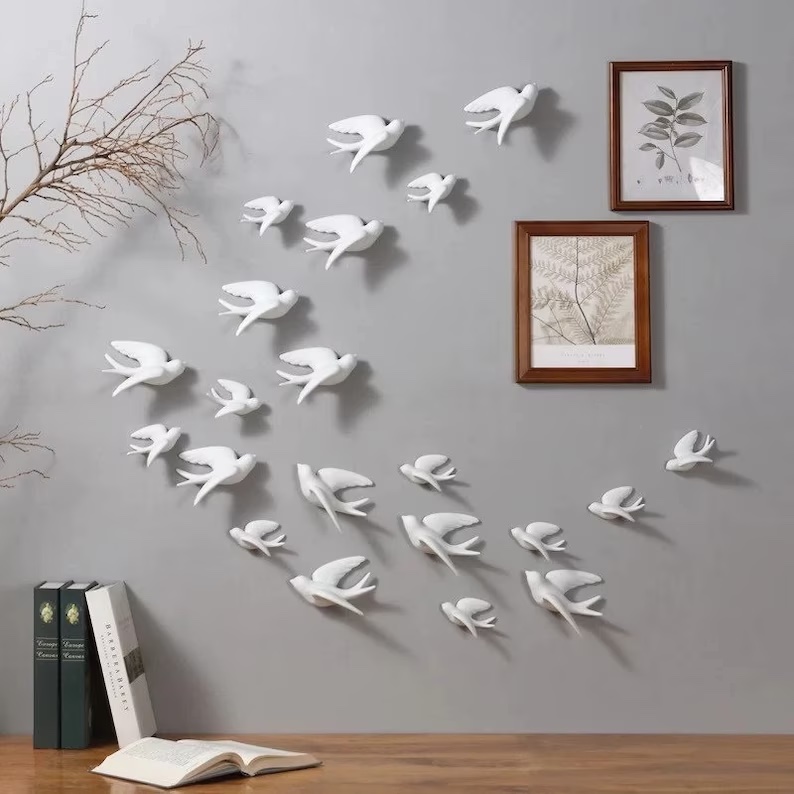 A photograph of wall bird decor to give an example of white decor