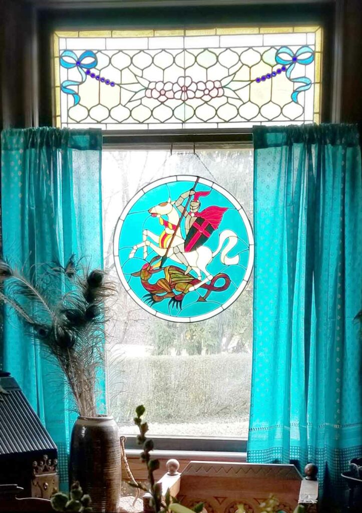 Example of modern bohemian style decor, a mosaic tile hanging on a window