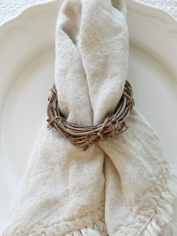 Example of DIY napkin rings featuring a woven ring made of grapevines