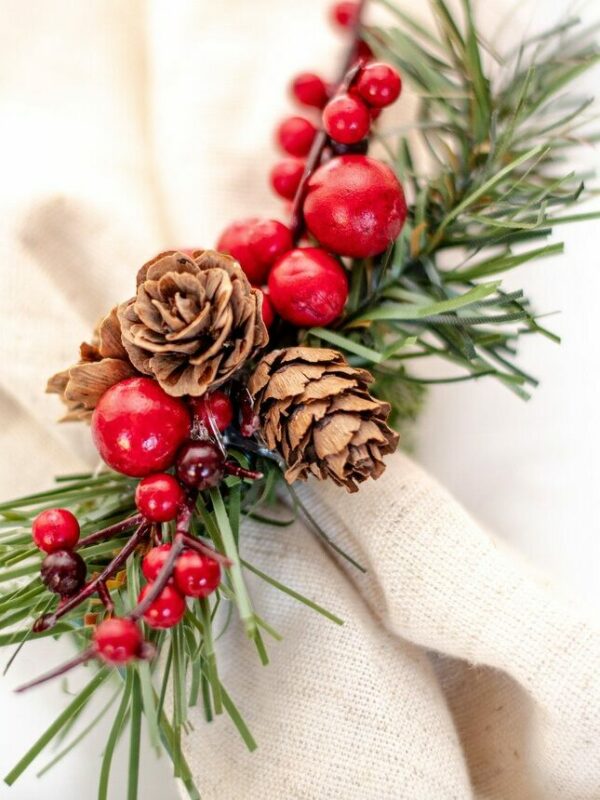 Photograph of Christmas napkin rings paired with rustic dinner cloth