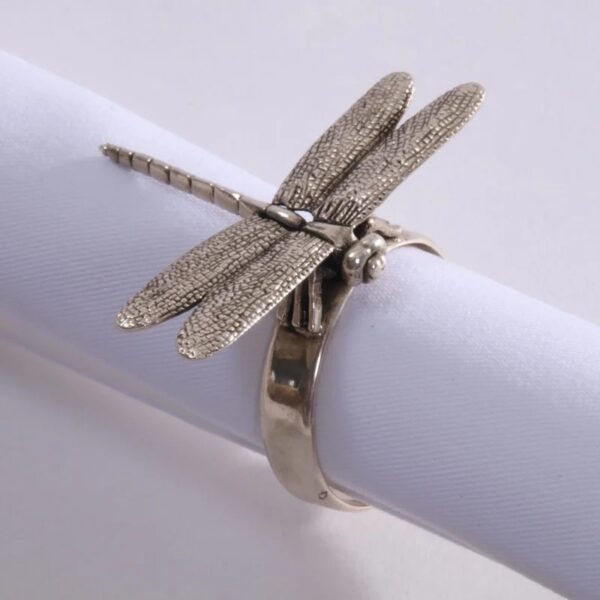 Example of a figural silver napkin ring featuring a silver dragonfly