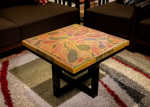 Photograph of unique coffee table demonstrating use of pop of color through furniture