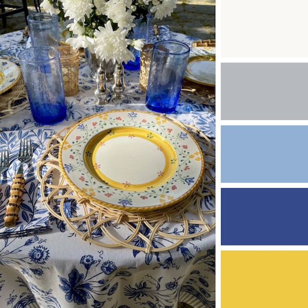 Photograph of a blue and yellow table setting to demonstrate when is wedding season for the summer