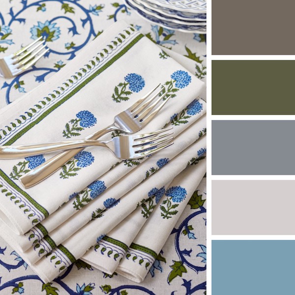Photograph of a white, blue, and green floral table setting to demonstrate when is wedding season for the winter months and how to decorate for it
