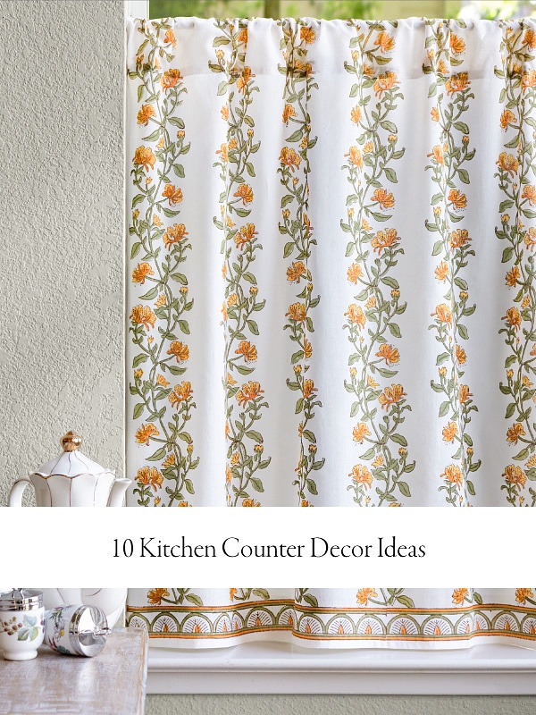 Photograph of a floral botanical white cafe curtain with partial kitchen counter with teapot and cups showcasing kitchen counter decor ideas