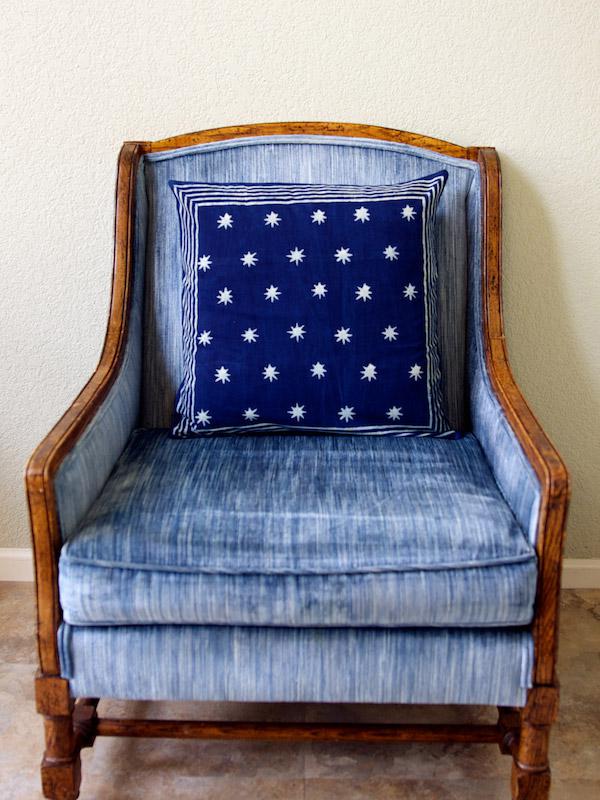 A blue throw pillow with white stars is great for summer decor in July!