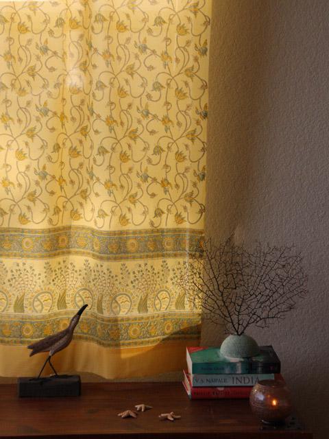 Yellow curtains with vine print are great for beach house style.