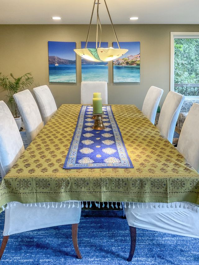 gold and green tablecloth with blue table runner in a Moroccan print 